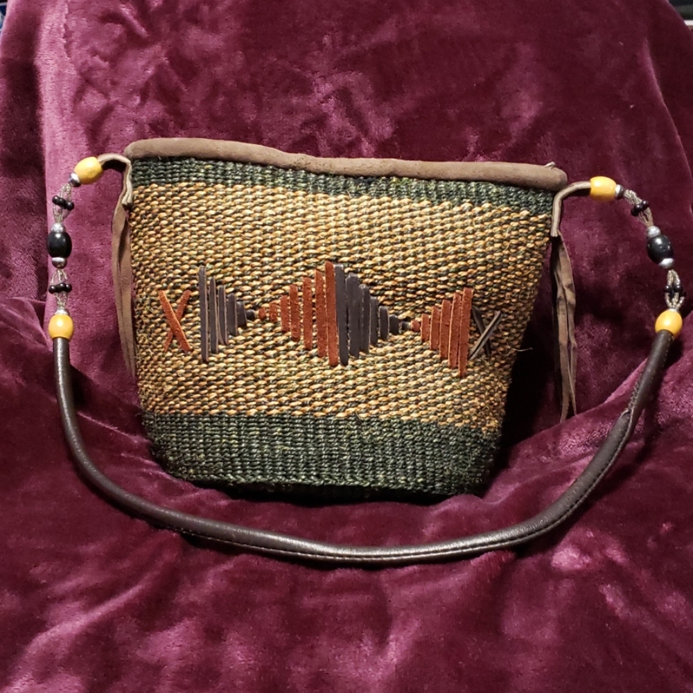 Woven straw handbag with beaded/leather strap